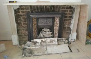 DAMAGED MARBLE FIREPLACE