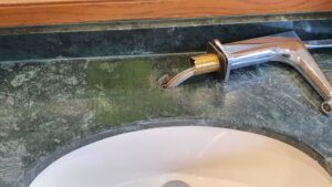 Resin Filler Applied to Damaged Area of a Marble Vanity Top